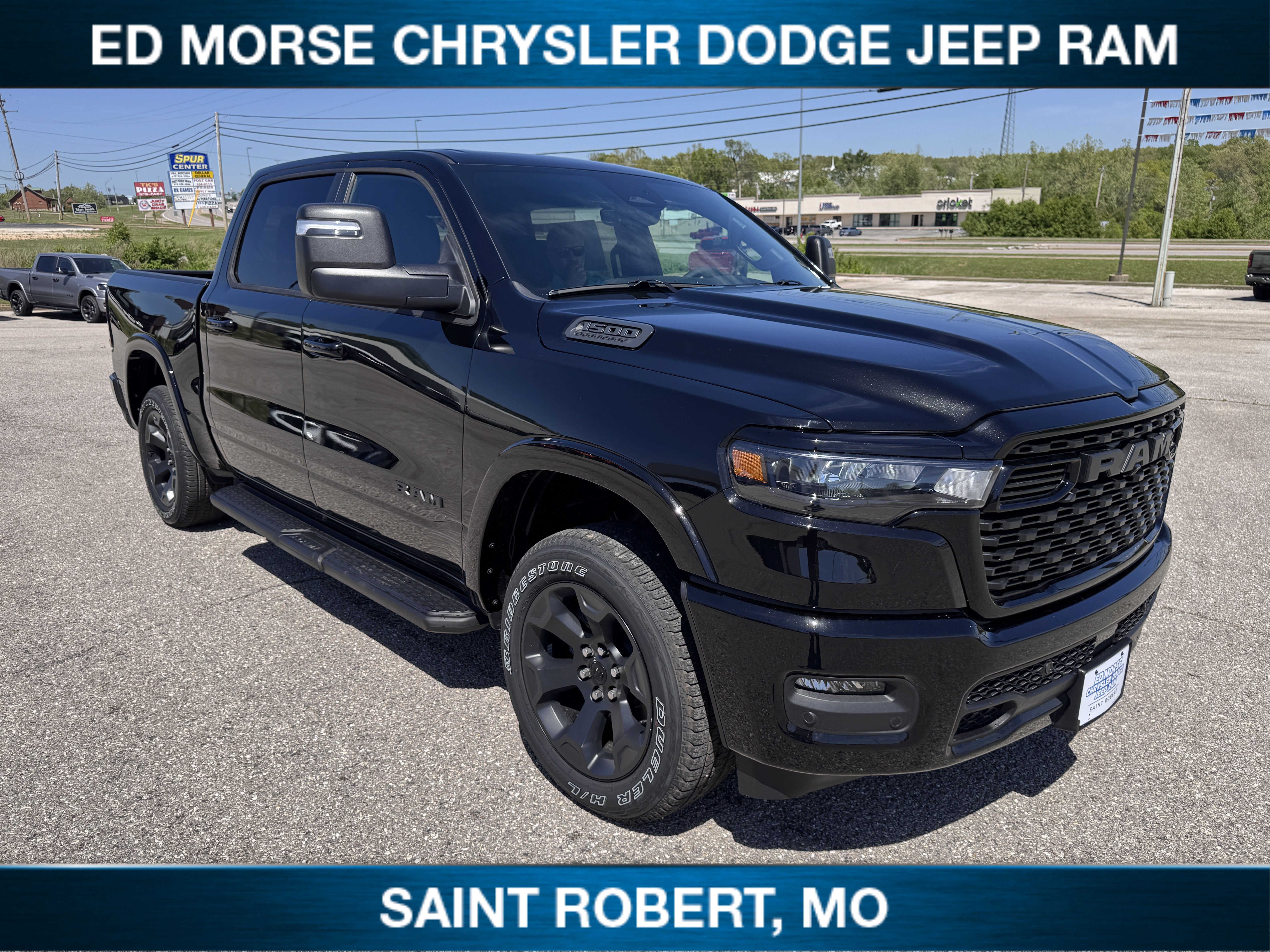 2026 RAM 1500 Big Horn in Diamond Black Crystal Pearlcoat — front three-quarter view