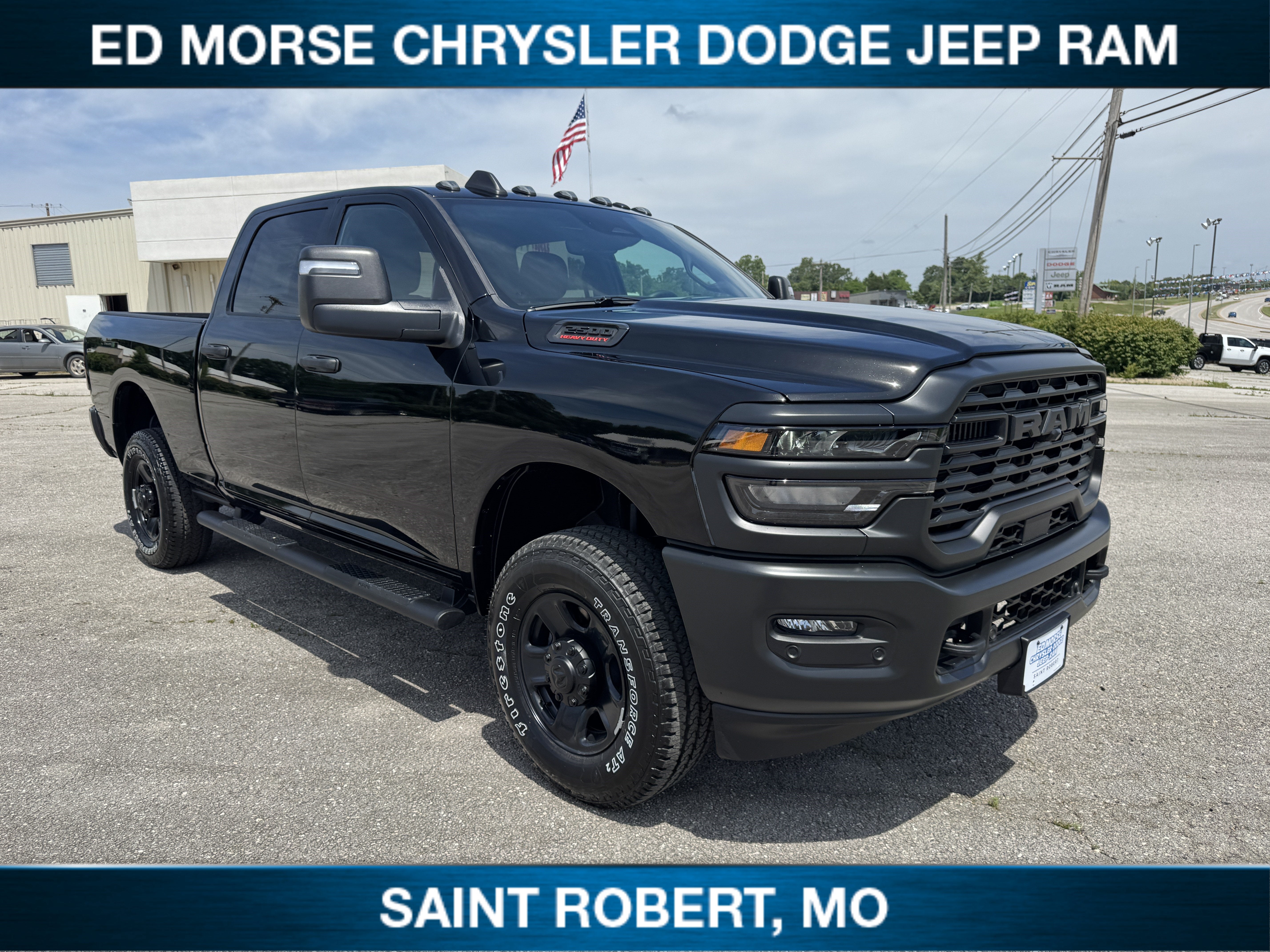 2026 RAM 2500 Tradesman in Diamond Black Crystal Pearlcoat — front three-quarter view