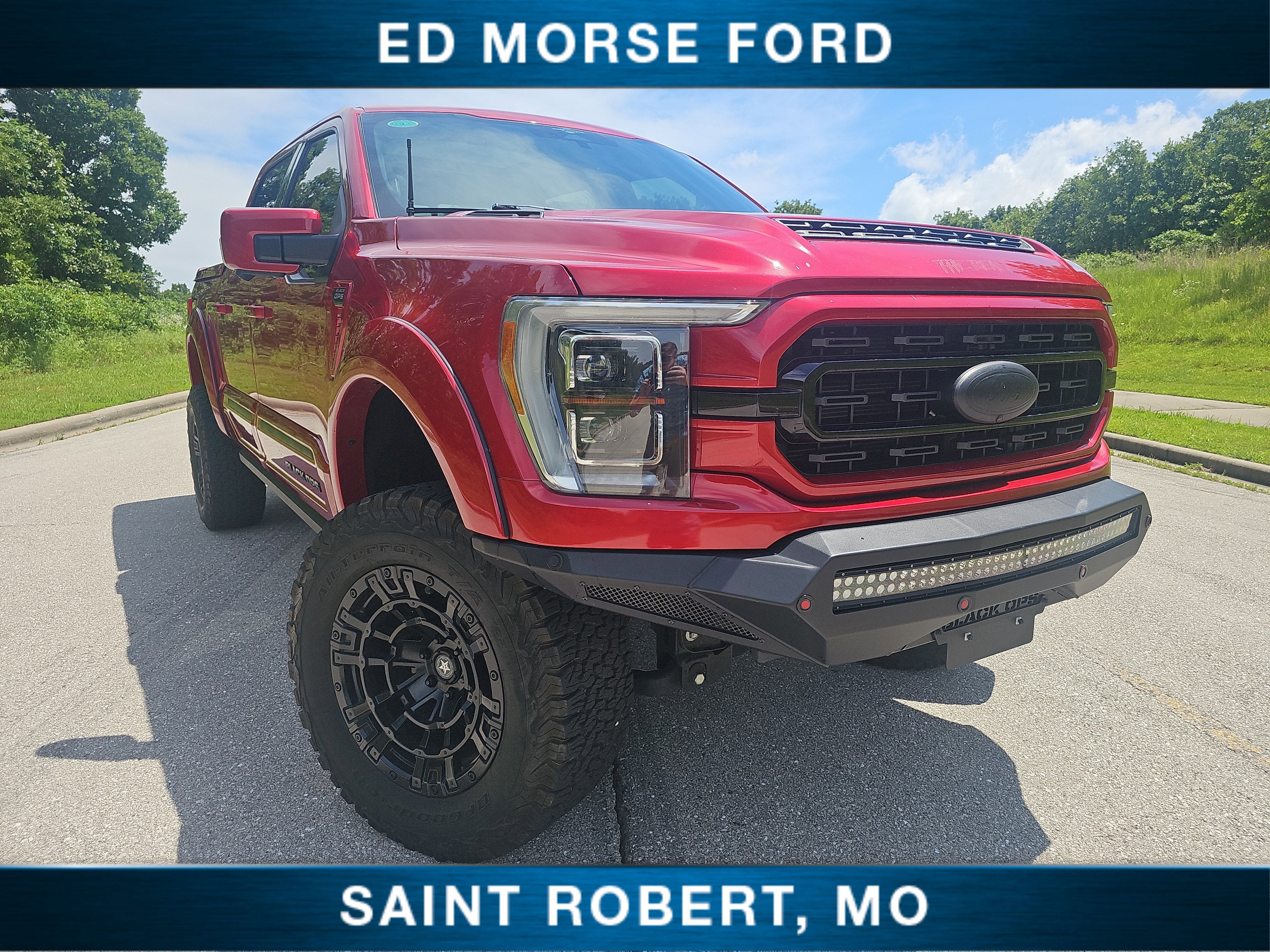 2023 Ford F-150 LARIAT in Red Metallic — front three-quarter view