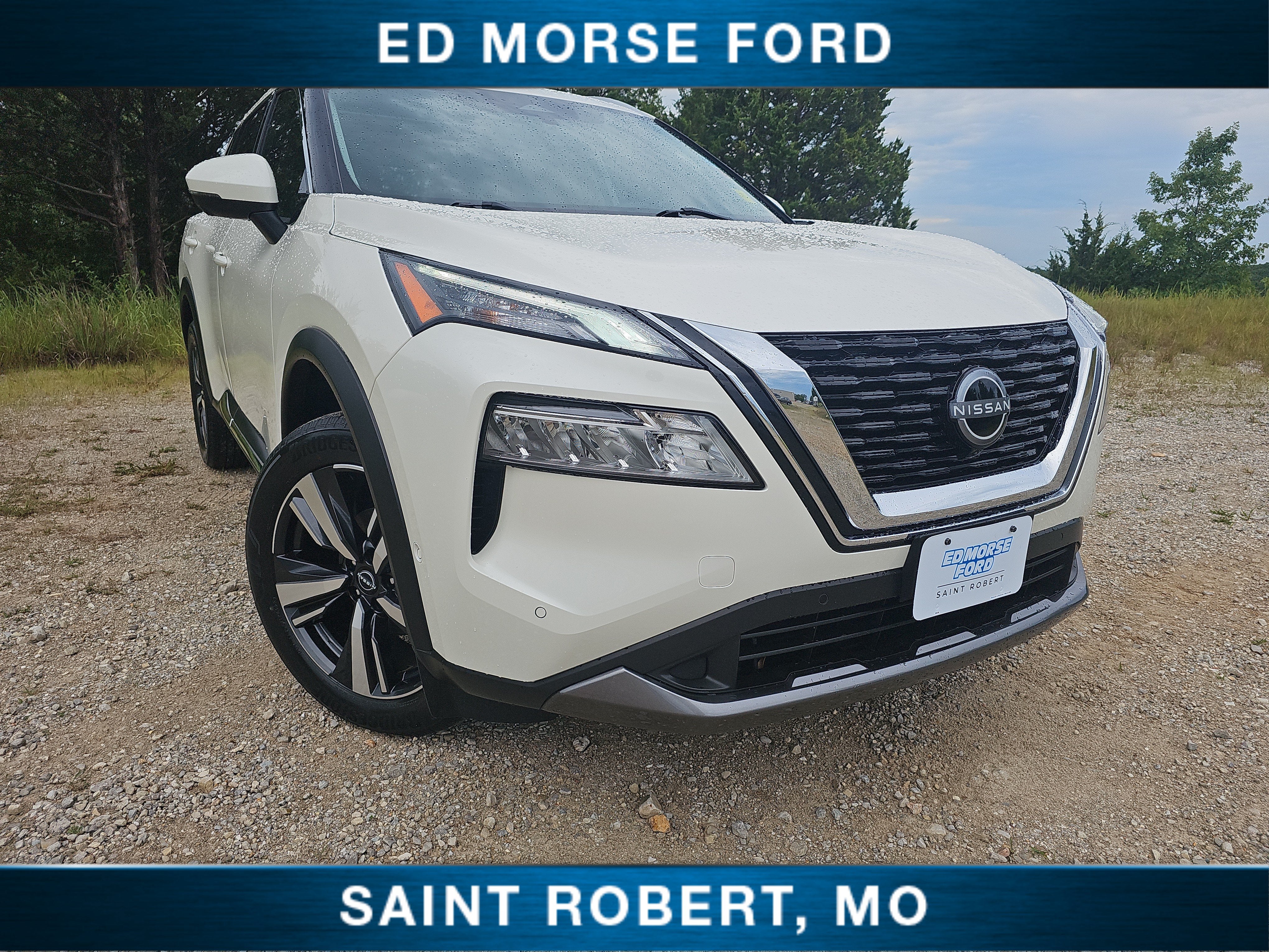 2023 Nissan Rogue SL in Pearl White Tricoat — front three-quarter view